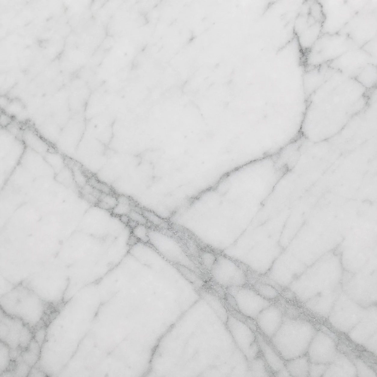 Close-up of honed Carrara marble with grey veining