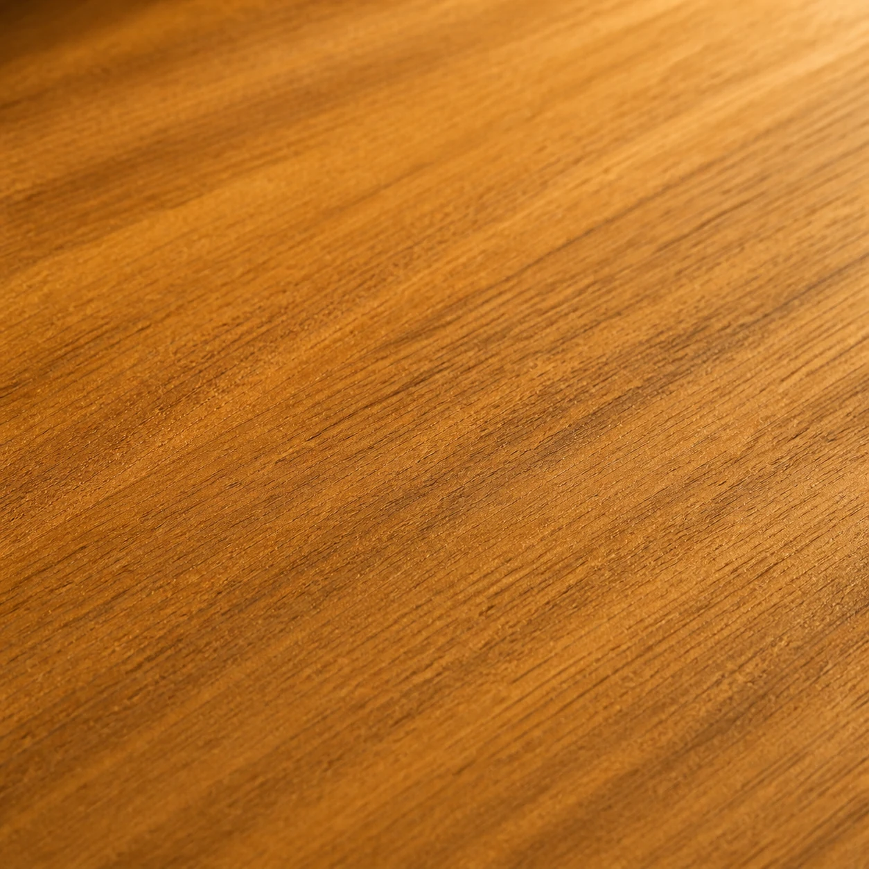 Close-up of natural teak wood grain used for outdoor furniture