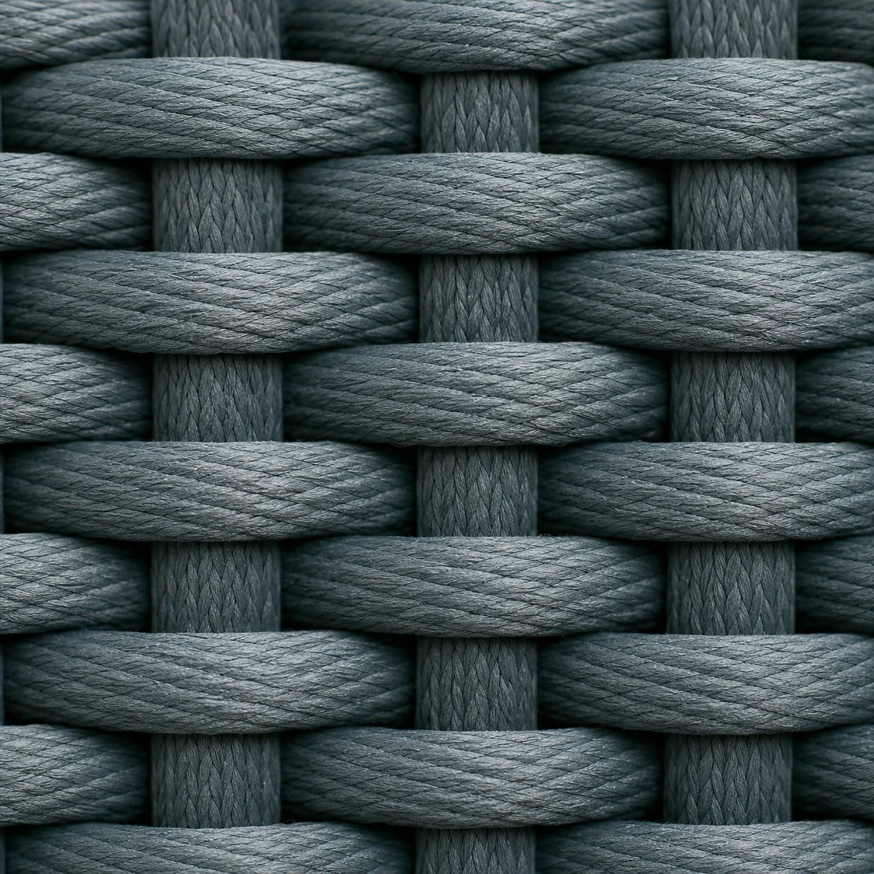 Close-up of dark woven rope used on outdoor seating