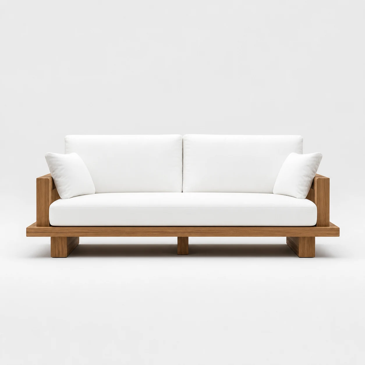 White cushioned teak outdoor sofa on a neutral background